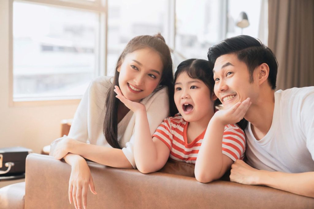 A happy family smiling for a picture.